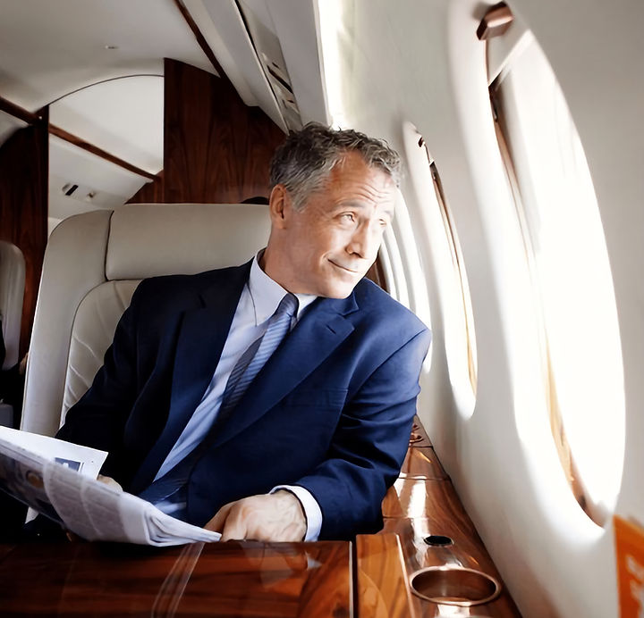 businessman-traveling-on-private-jet-600nw-1876722400_edited.jpg
